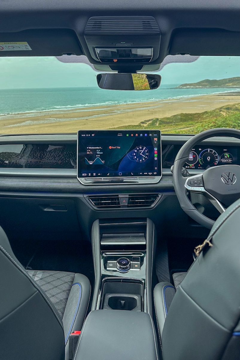 Car interior with ocean view through windshield