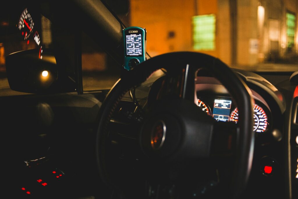 black steering wheel in close up photography