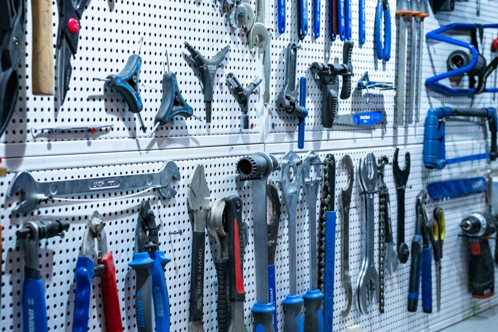 a bunch of tools hanging on a wall