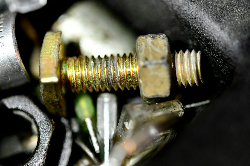 a close up of a screw and a nut