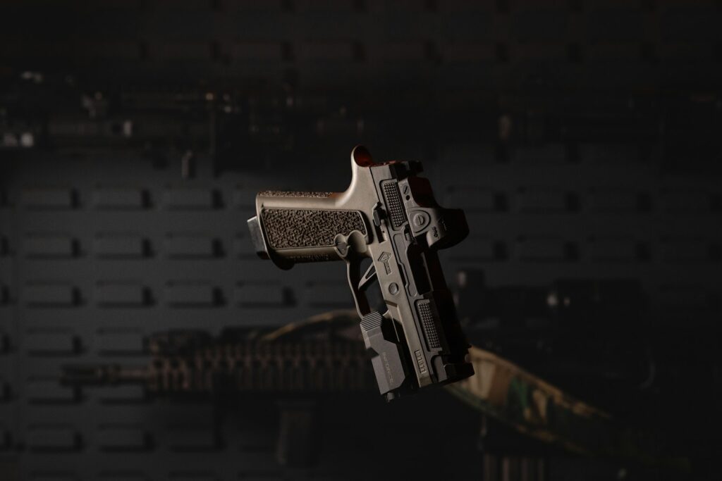 a close up of a gun in the air