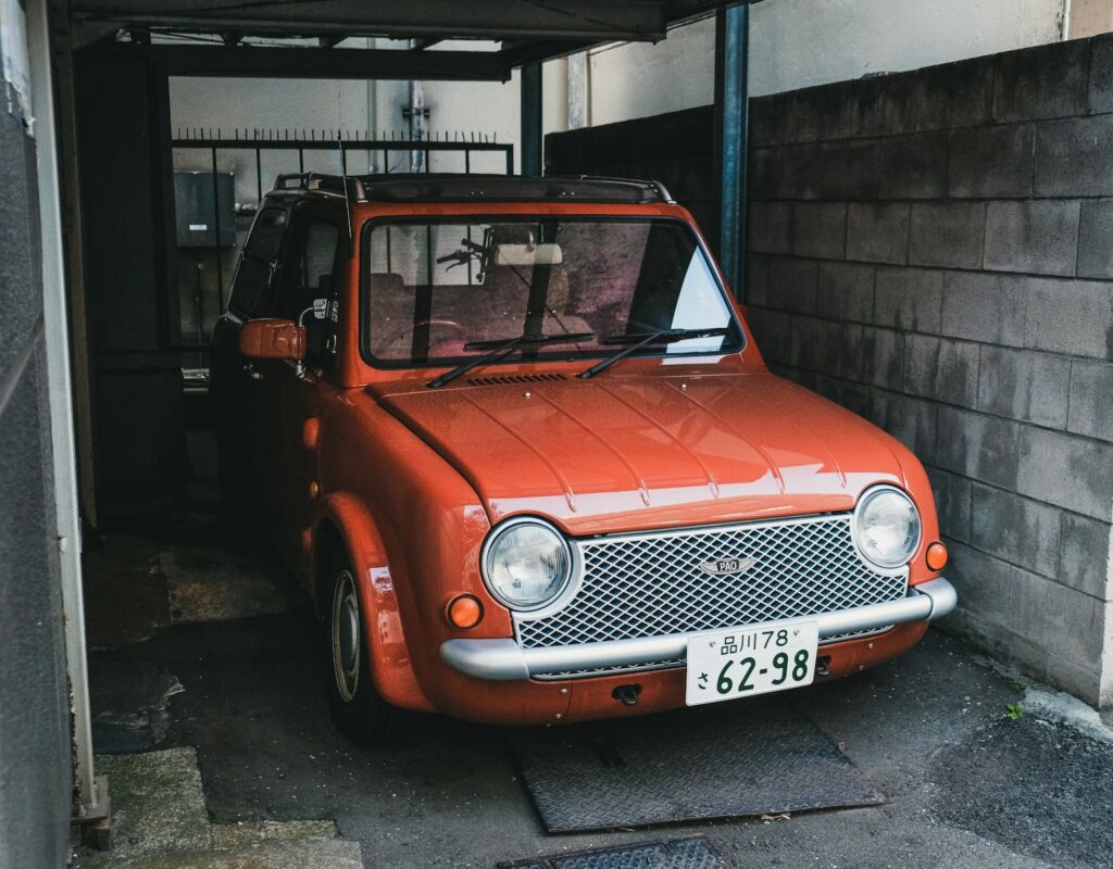 orange vehicle park on garage