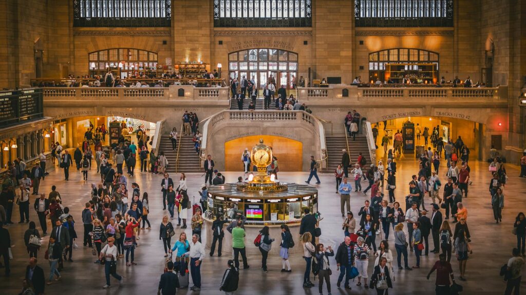A busy day inside Grand Central Terminal with commuters and tourists in New York City.