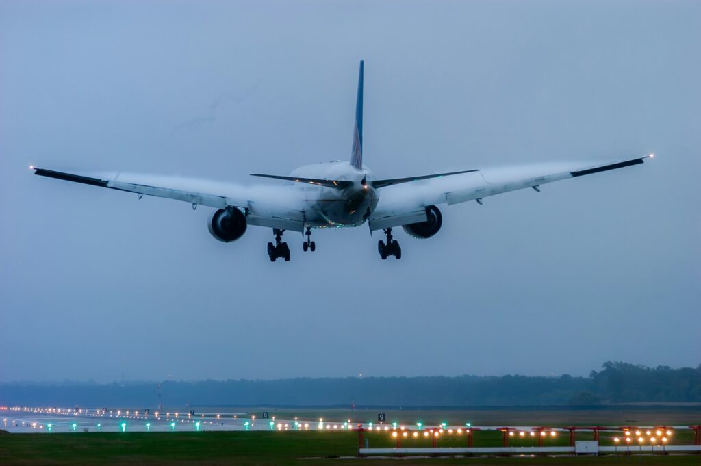 a large jetliner taking off from an airport runway