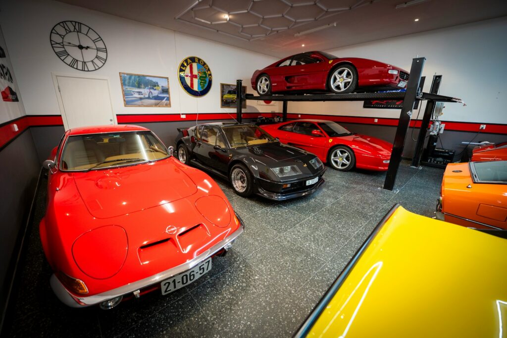 Luxurious garage displays several sports cars.