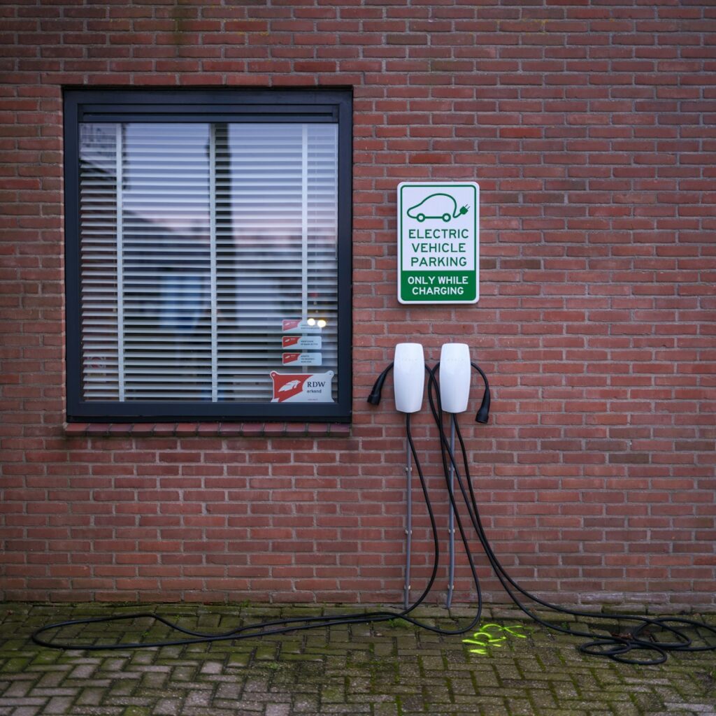 A brick building with a sign on the side of it