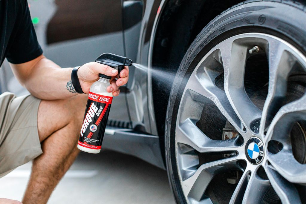 applying wheel cleaner