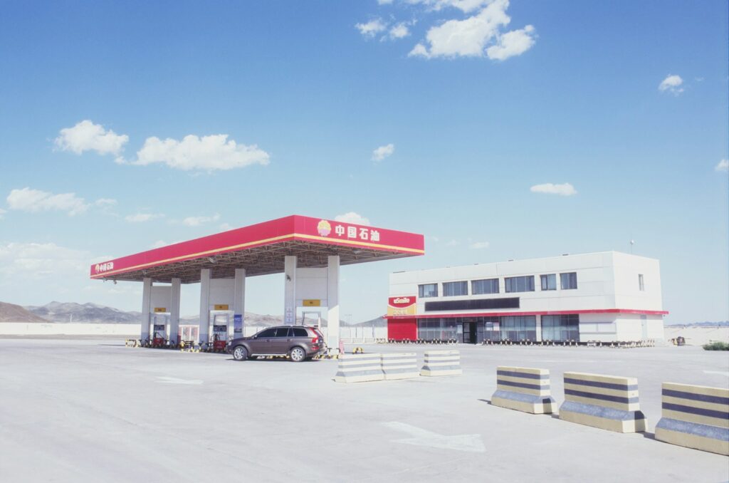 Gas station with car under bright blue sky