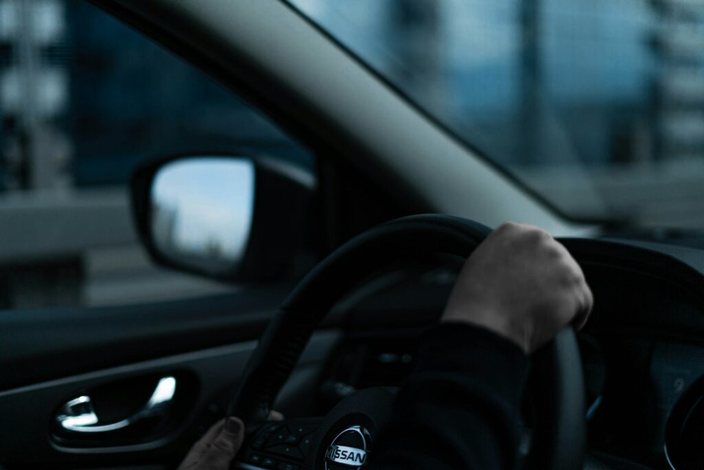 a person driving a car in the city