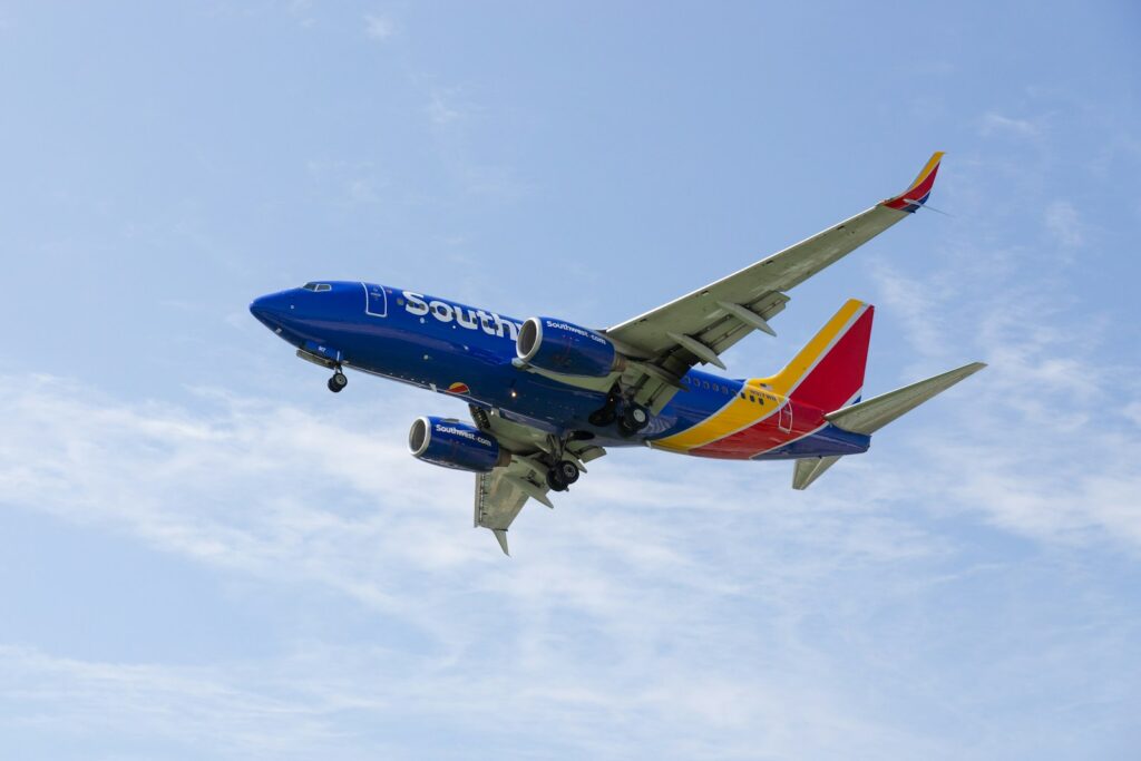 a southwest airlines plane flying in the sky