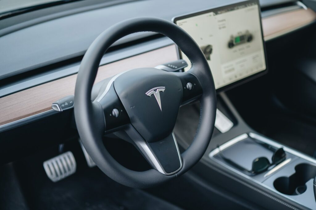 a close up of a steering wheel and dashboard of a car
