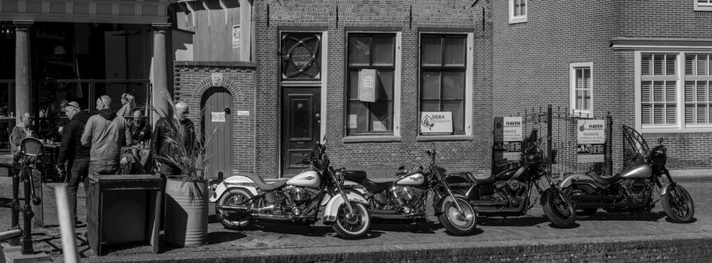 Motorcycles parked in front of a building.