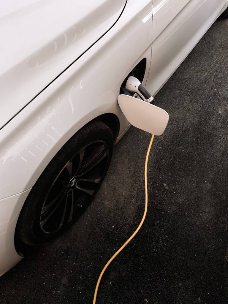 An electric car plugged in to a charger