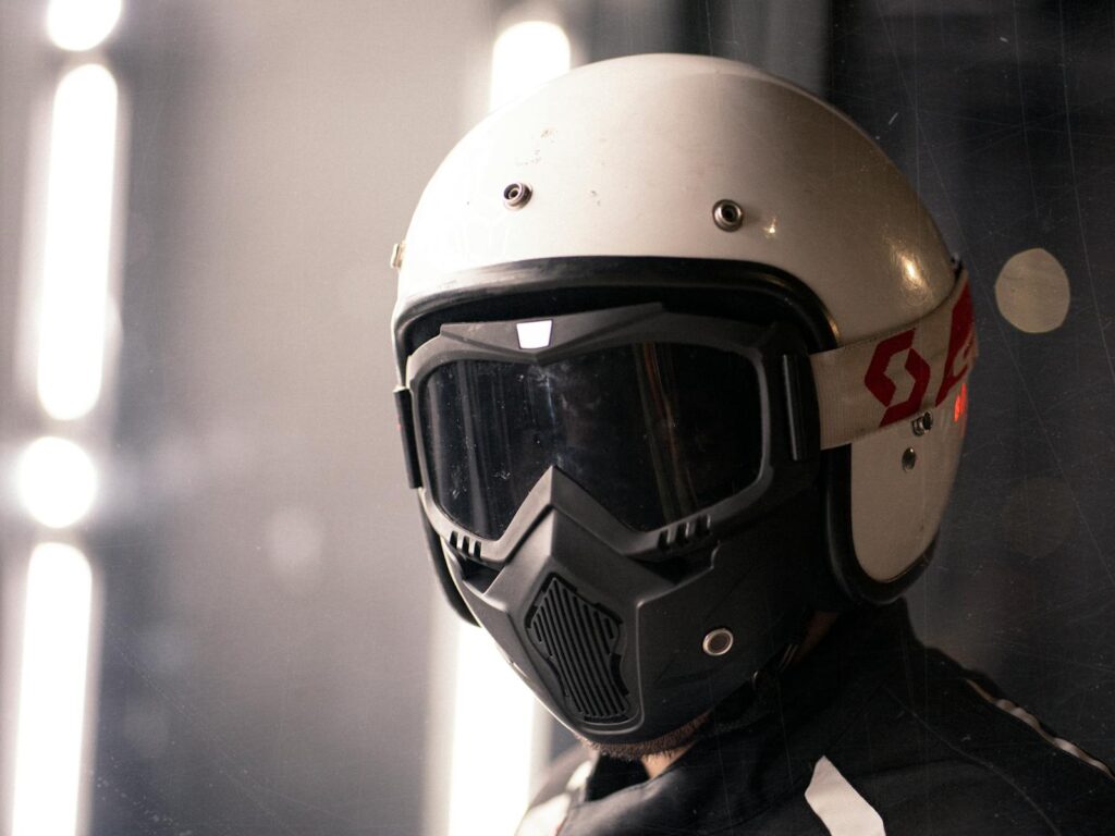 A focused look at a person wearing a helmet with protective goggles, emphasizing safety gear.