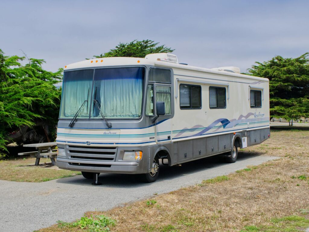 Explore the scenic campsite with a comfortable RV parked at Half Moon Bay.