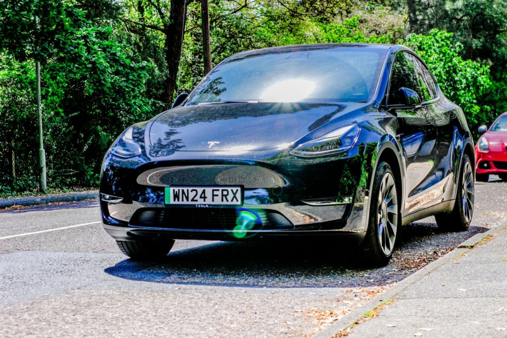 Two cars are parked on the side of the road