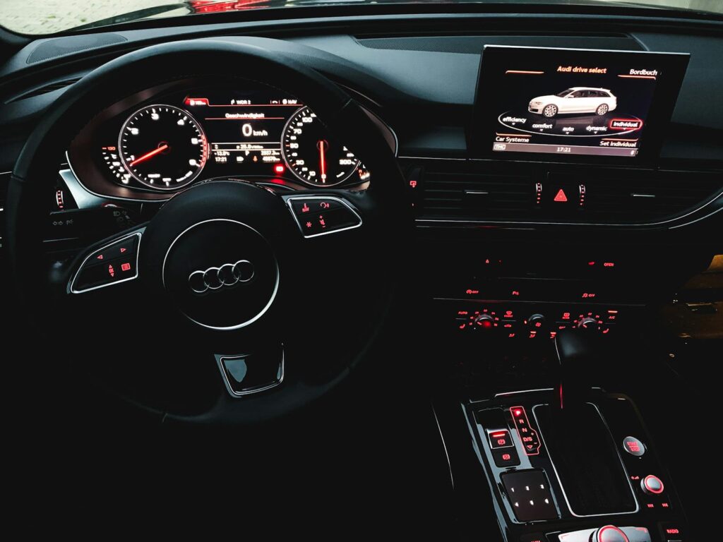 Close-up view of a luxury car's interior showing the dashboard and controls.