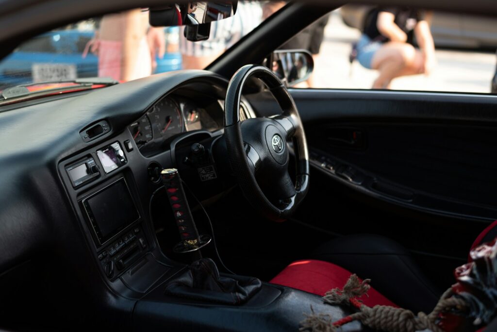 a car parked in front of a mirror posing for the camera