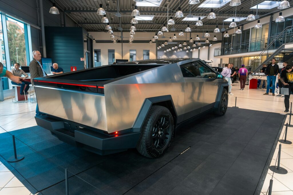 A silver truck parked inside of a building
