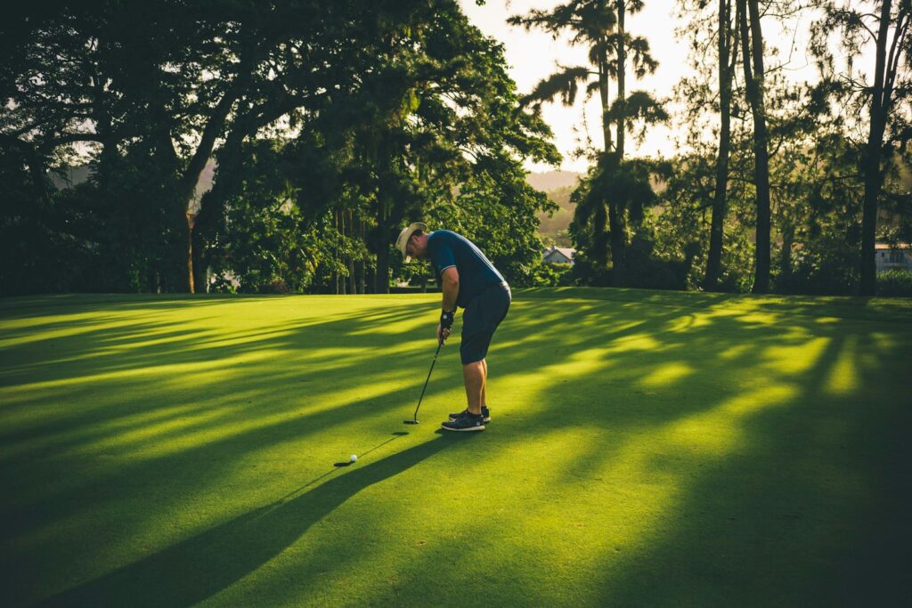a man playing golf on a sunny day