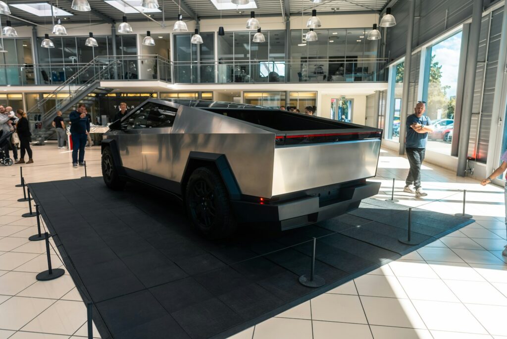 A futuristic car is on display in a building