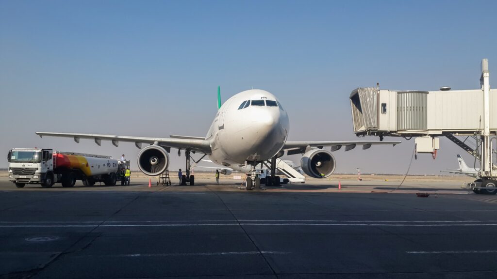 A large jetliner sitting on top of an airport tarmac