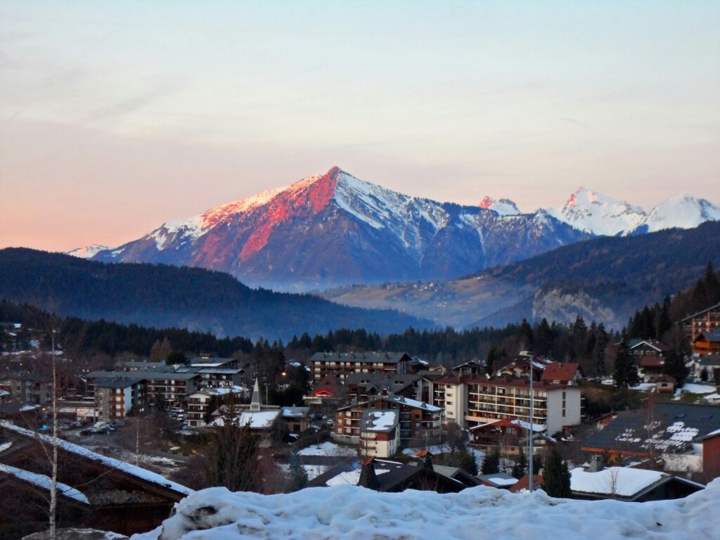 a town with snow covered mountains