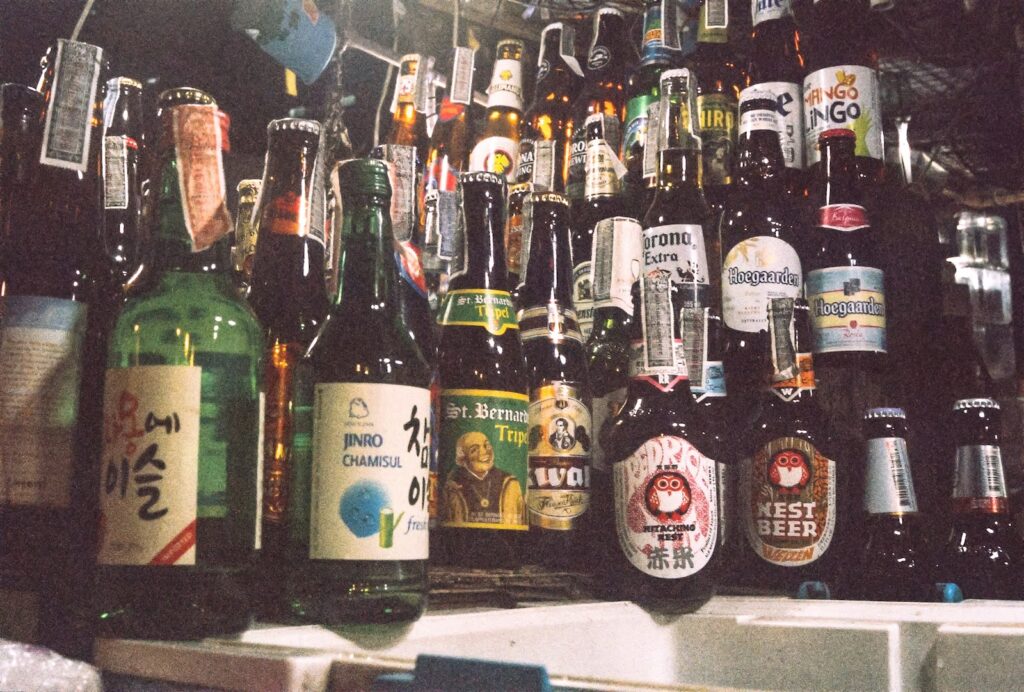 six bottles on black table