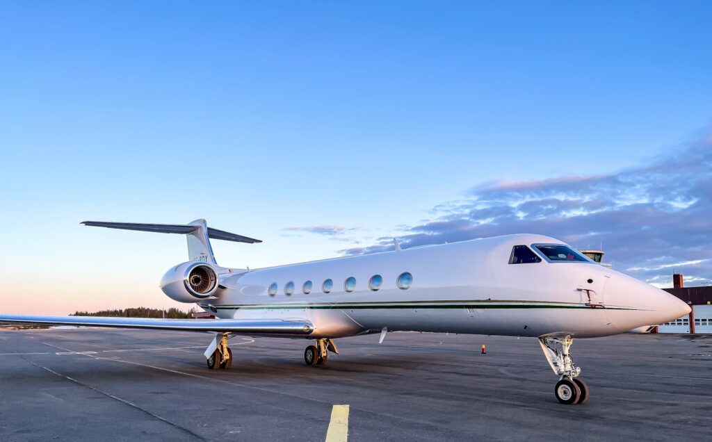 a private jet sitting on the tarmac of an airport
