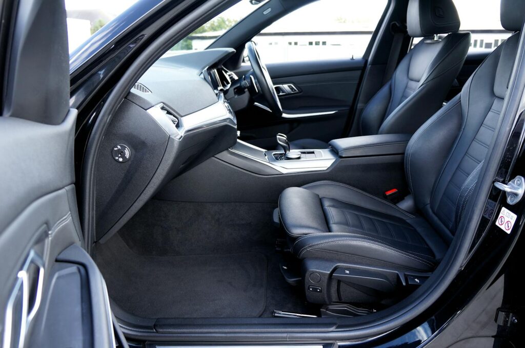 Explore the sleek design of this luxury sedan's interior with premium leather seats and modern features.