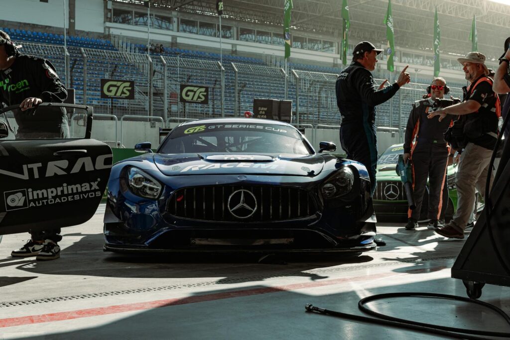 GT Series Cup race car and team preparing for the race on the track.
