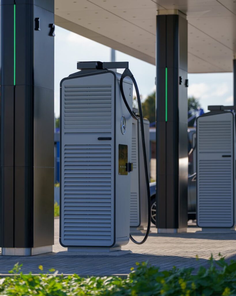 Outdoor electric vehicle charging station with multiple charging units under a canopy.