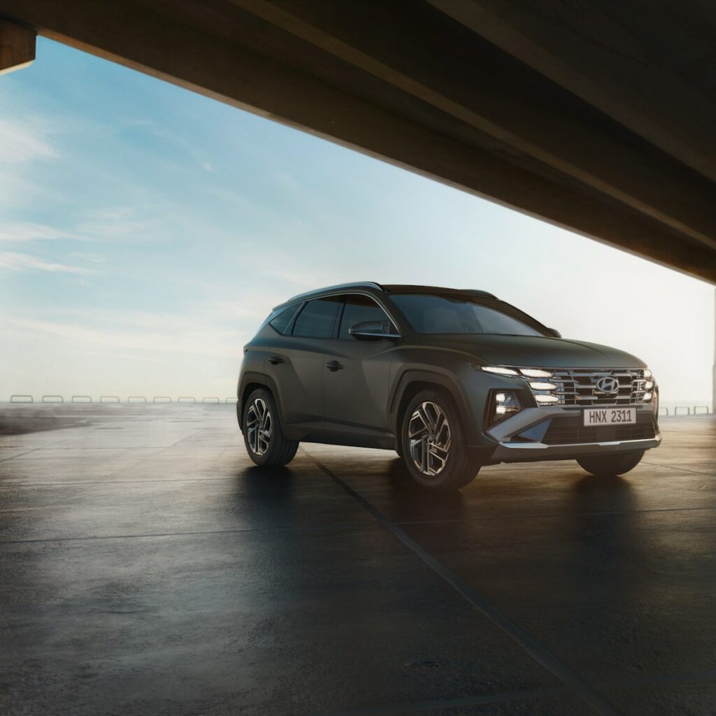 a grey suv parked in a parking lot