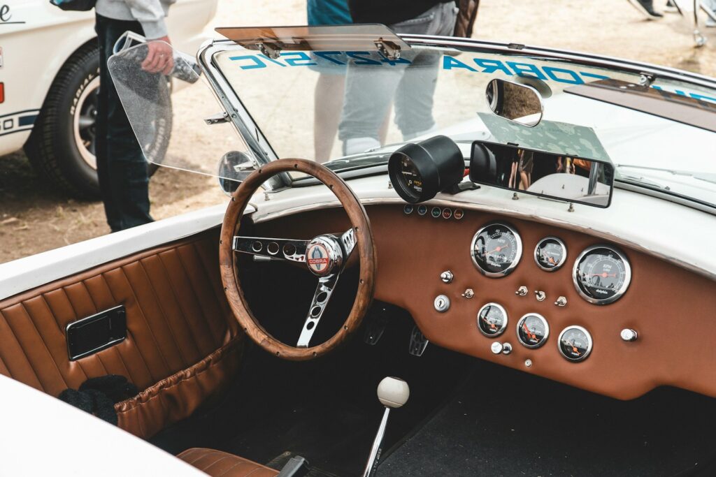a car with a steering wheel and dashboard