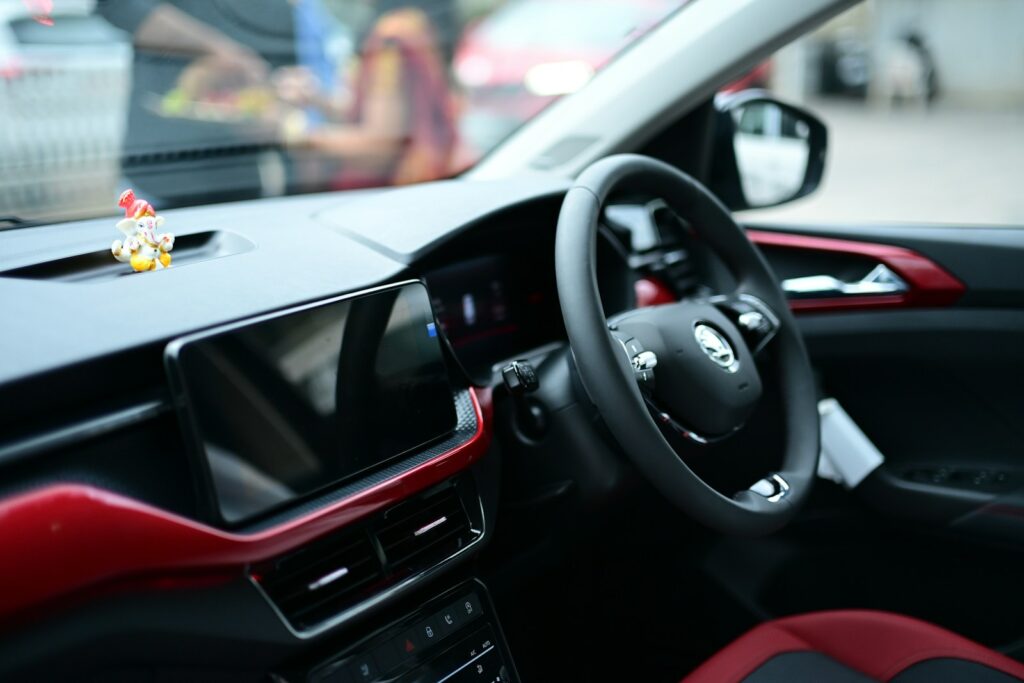 Modern car interior with touchscreen and steering wheel