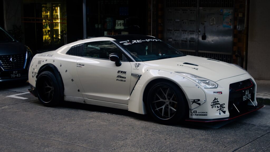 White modified sports car parked on street