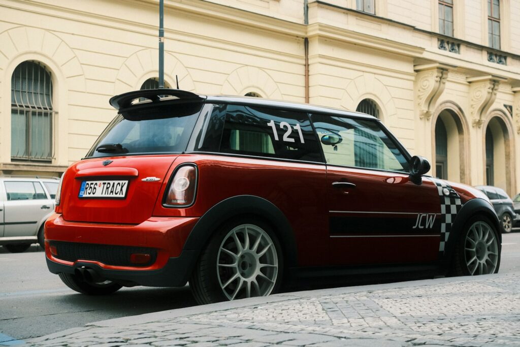 Red mini cooper parked on a city street