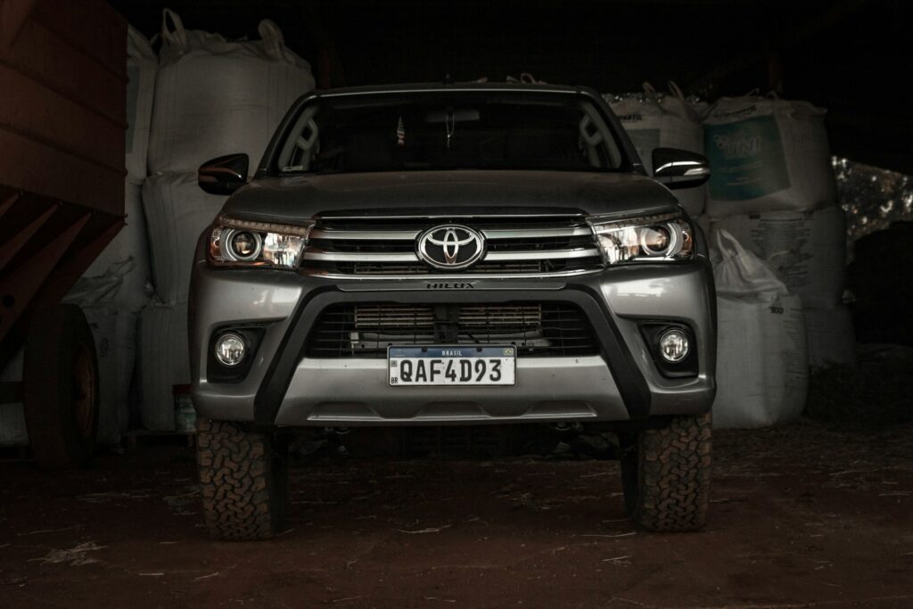 a silver truck is parked in a garage
