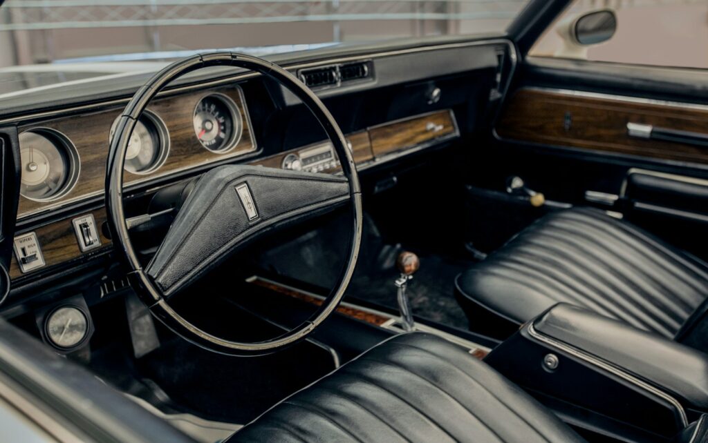 Interior of a vintage car with leather seats.