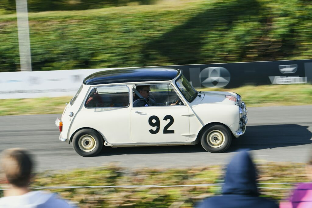 White classic mini cooper with number 92 racing.