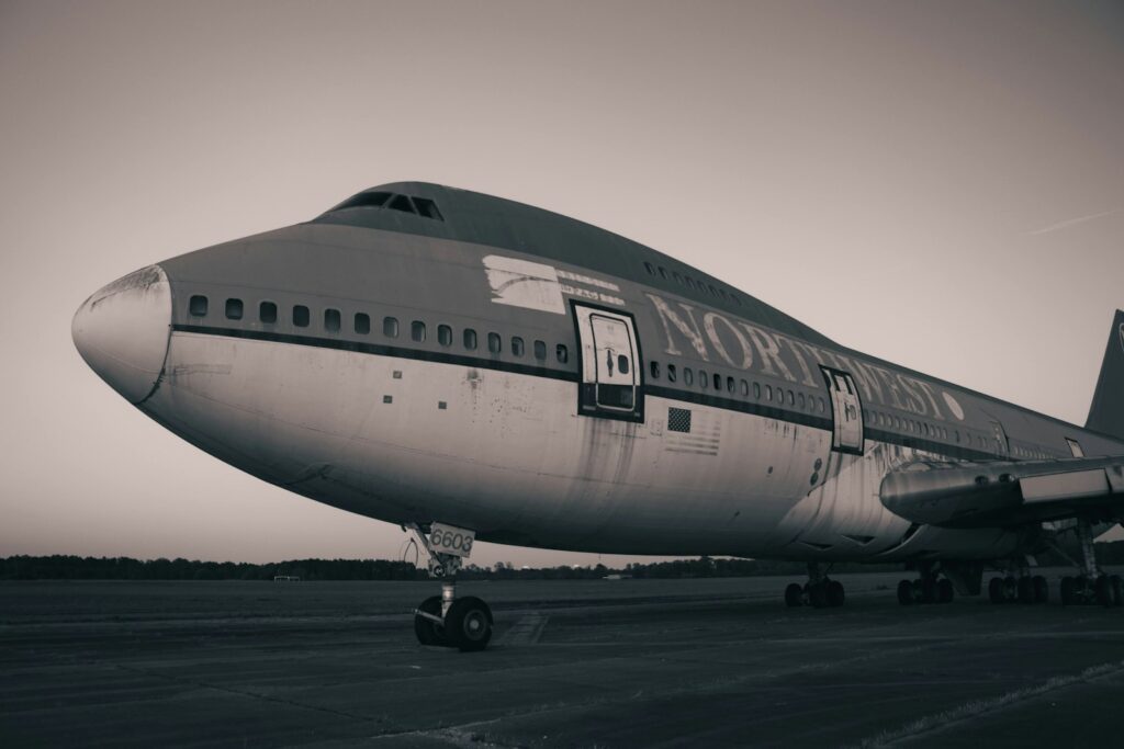 a large passenger jet sitting on top of an airport tarmac