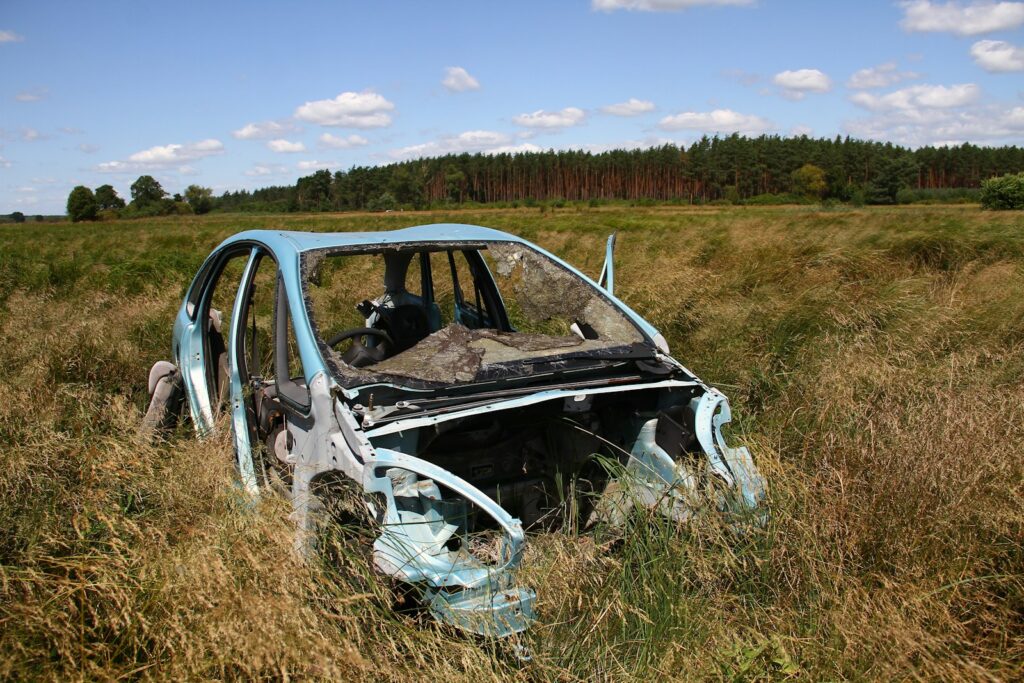 A car that is sitting in the grass