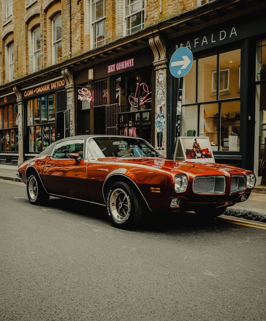 A red car parked on the side of the road