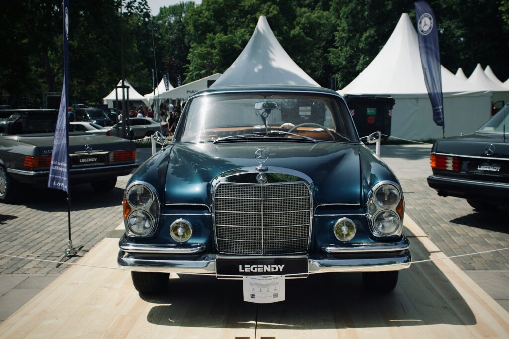 a vintage car parked in a parking lot