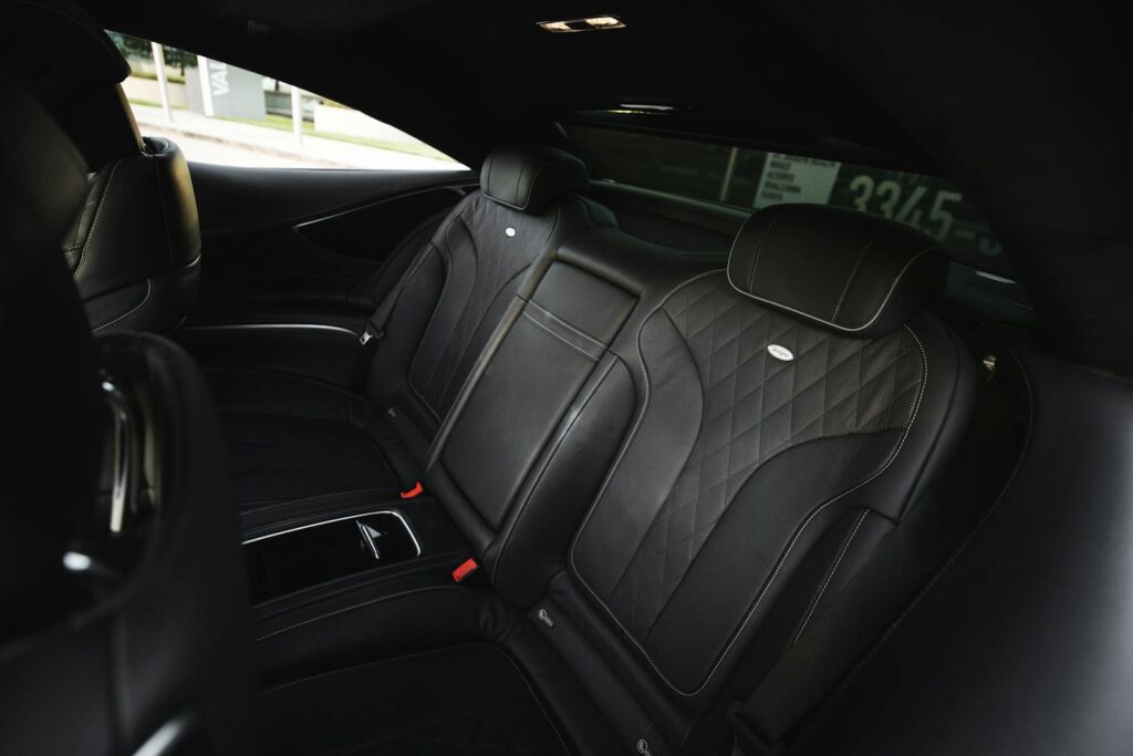 Explore the elegance of black leather seating in a luxury car interior. Ideal for automotive enthusiasts.