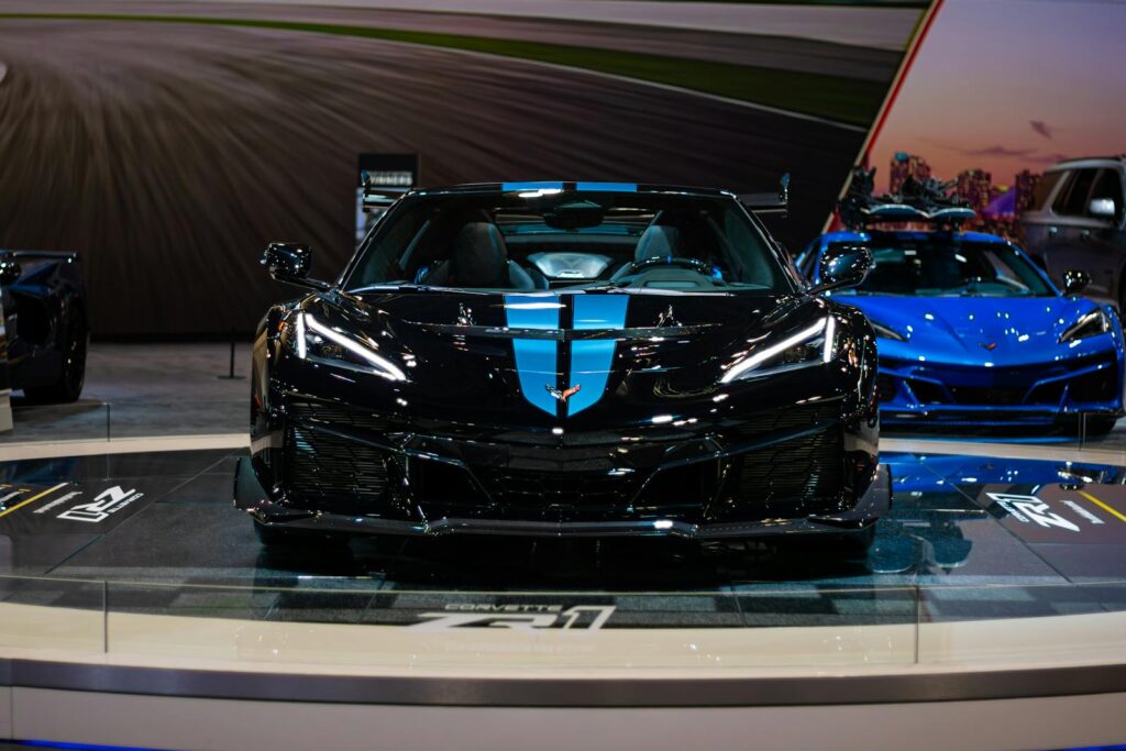 Capture the elegance of a black and blue Corvette showcased at the Toronto Auto Show, embodying automotive engineering and design.