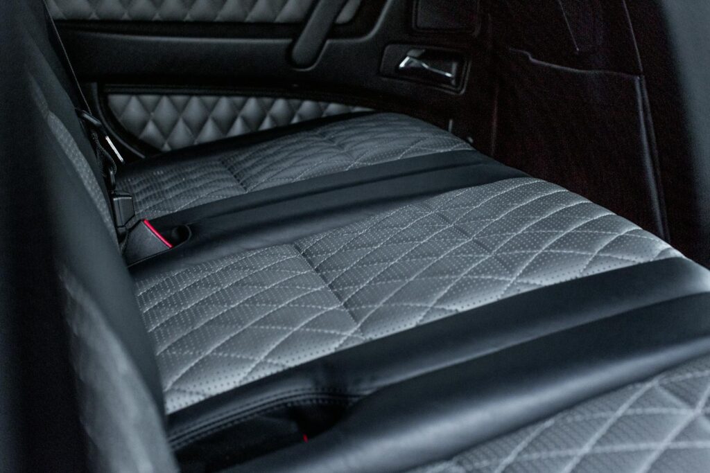 High-quality image of a luxury car's quilted leather interior, showcasing elegant design.