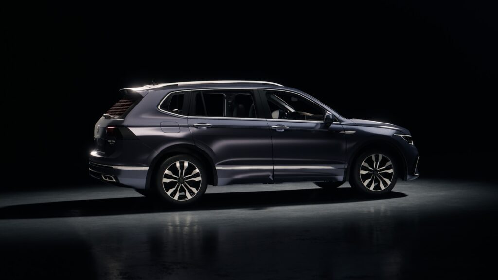 Dark blue suv parked on a reflective surface.