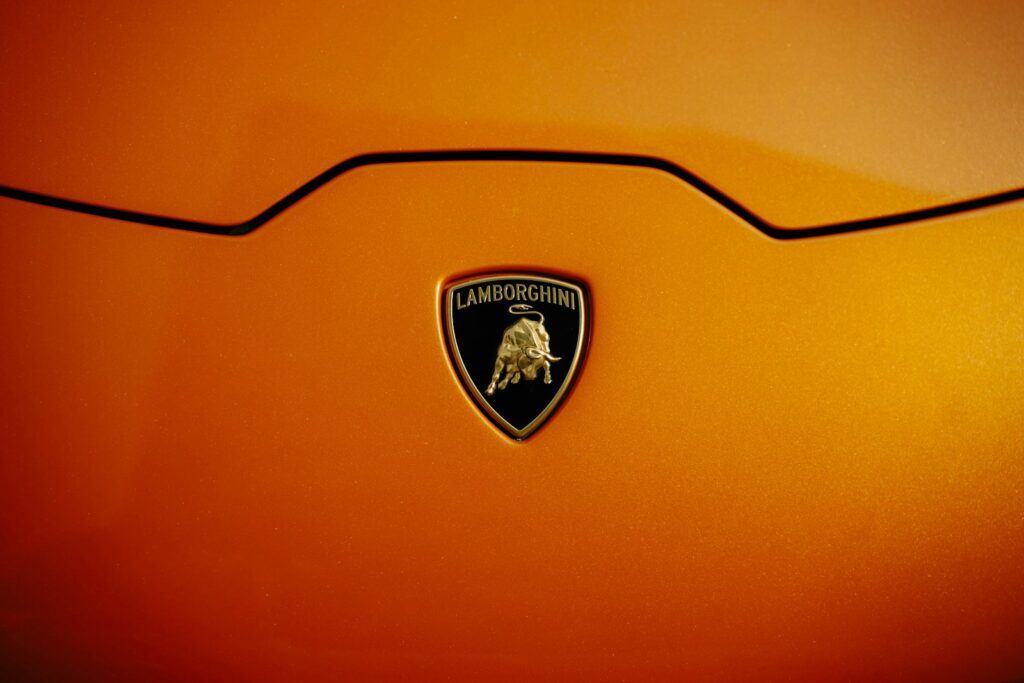 Lamborghini emblem on an orange car