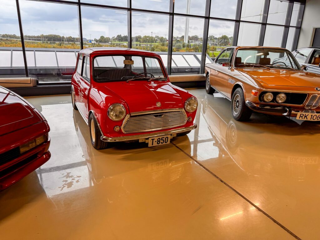 A red classic mini cooper parked indoors